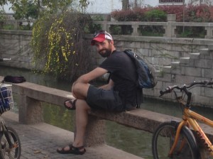 Chris sitting along the canal in the Pingjiang District. 
